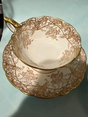 1 Gold Filigree Porcelain Teacup and Saucer - White and Gold